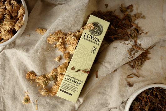 LUWIN Ultimate repair and clear face cream for acne prone skin surrounded by dried Chinese herbs