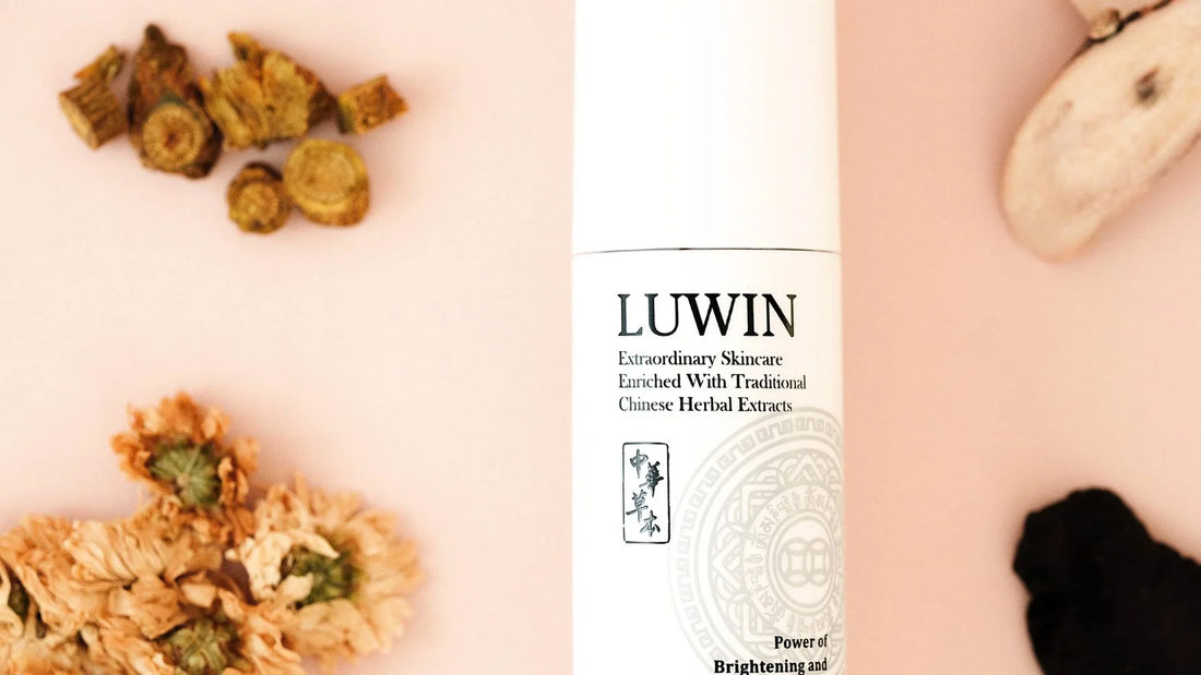 LUWIN skincare bottle with Chinese herbs next to it including Chrysanthemum, Scutellaria Caicalensis root, Paeonia Albiflora Root