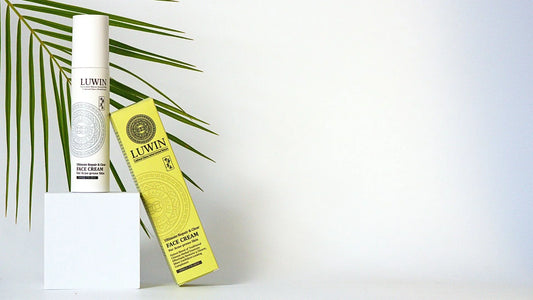 LUWIN ultimate repair and clear face cream for acne prone skin in its white airless pump bottle and bright yellow package in bright studio setup