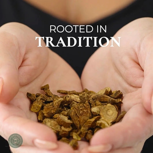 Hands holding dried roots with 'Rooted in Tradition' text highlighting LUWIN skincare heritage and brand. 