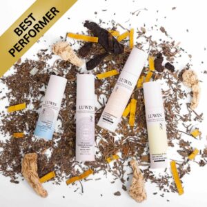 A lineup of LUWIN Power of Brightening & Renewal Face Serum, Power of Brightening & Rejuvenating Face Cream, All-rounder Calming Facial Mist, and Ultimate Repair & Clear Face Cream, surrounded by TCM herb. Image has 'Best performer' in the top left corner.