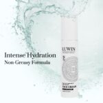 A luxurious white bottle of LUWIN Power of Brightening & Rejuvenating Face Cream stands upright, surrounded by dynamic water splashes, emphasizing its lightweight, non-greasy formula designed to deliver intense hydration.