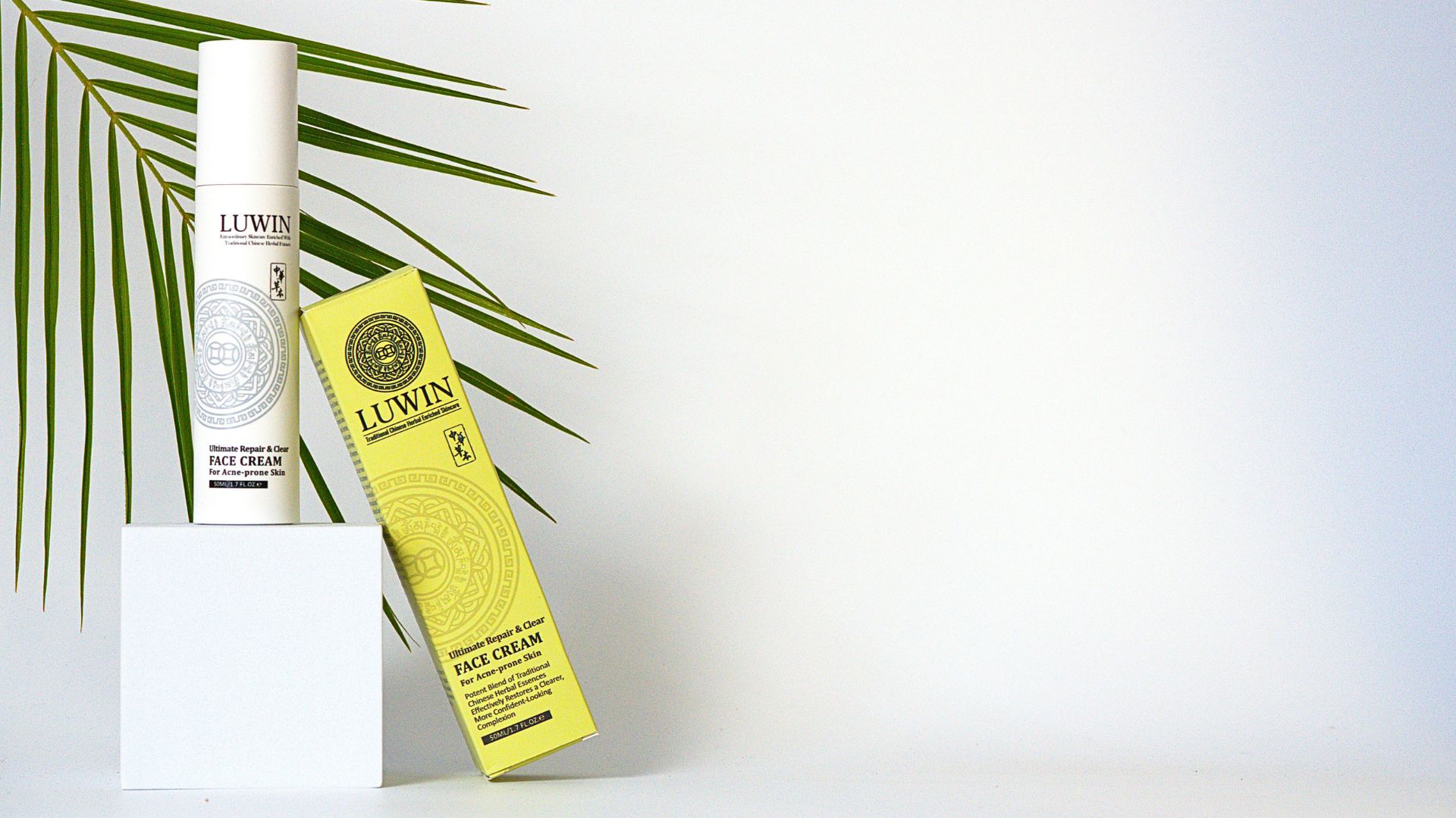 LUWIN Ultimate Repair & Clear Face Cream for acne-prone skin, upright elegant bottle with yellow packaging box tilted and resting against it